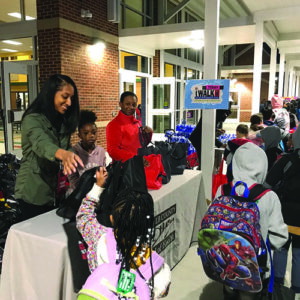 Kids pickup free school supplies